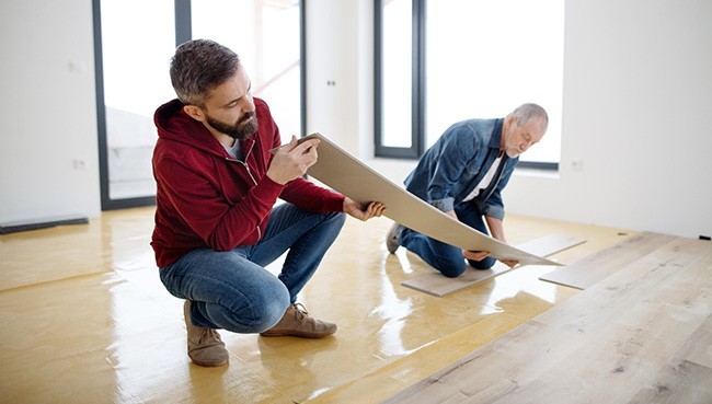 Men Installing Vinyl | The Floor Store VA