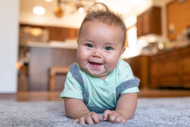 Baby lying on carpet | The Floor Store VA